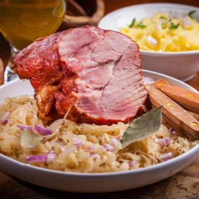 Crockpot Sauerkraut Ham - It's slightly vinegary from the sauerkraut, sweet from the apples, and hearty because of the ham and grated potatoes. Serve with a tall, cold glass of beer. Instant Pot Pork Loin Recipe, Crockpot Sauerkraut, Pork Roast And Sauerkraut, Bone In Pork Loin, Crockpot Ham, Fermented Cabbage, Sauerkraut Recipes, Ham Recipe, Instant Pot Pork