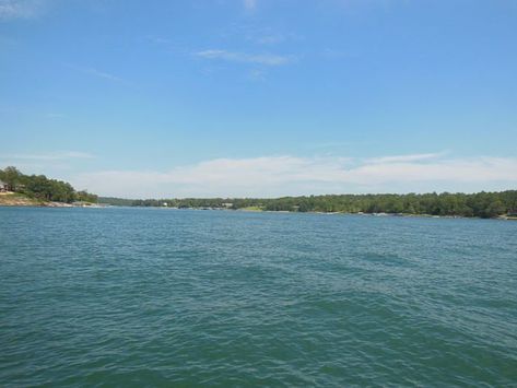 Covering nearly 22,000 acres, Smith Lake is hailed as the Southeast's most beautiful lake. It's also the third cleanest lake in the United States. Smith Lake Alabama, Chattahoochee River, Alabama Travel, Big Lake, Lake Trip, Natural Bridge, Lake Fishing, Clear Lake, Scenic Byway