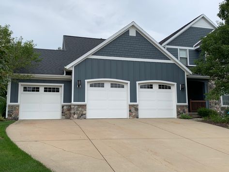 Love this dusty blue exterior color for a lake house Blue Exterior House Colors Farmhouse, Modern Blue Exterior House Colors, Black Roof Blue House, Exterior House Blue, Blue House With Stone, Modern Farmhouse Blue Exterior, Dusty Blue Exterior House, Blue And White Exterior House, Slate Blue Exterior House Colors