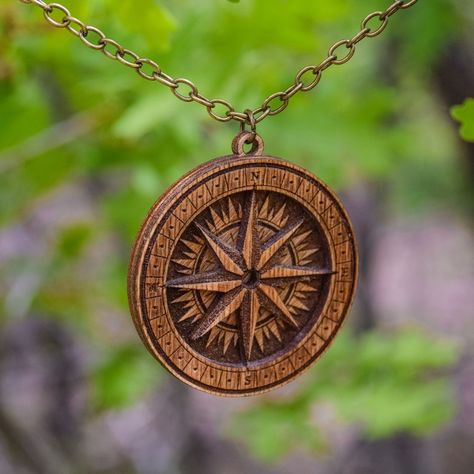 Get ready to explore new horizons with this handmade wooden compass necklace. Ideal for adventurers, travelers, and those who seek direction in life, this compass pendant is a truly unique and one-of-a-kind piece that reflects your love for exploring the world. Whether you're looking for a gift for a friend, family member, or loved one, or simply want to treat yourself to a new piece of jewelry, this wooden compass necklace is sure to make a statement. Compass Rose Necklace, Direction In Life, Boho Style Accessories, Wilderness Explorer, Rose Medallion, Compass Pendant, Compass Necklace, Compass Rose, Book Jewelry