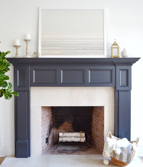 The fireplace paint color is Benjamin Moore Midnight Oil. Art is Patagonian Winter print from Minted.  #fireplaces Benjamin Moore Midnight Oil, Benjamin Moore Midnight, Coastal Castle, Painted Mantel, Painted Fireplace Mantels, Farmhouse Fireplace Mantels, Painted Fireplace, Grey Fireplace, Cottage Fireplace