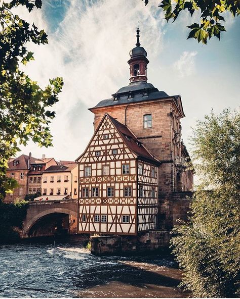 Old Town Hall, Bamberg, Germany 🇩🇪 The historic Old Town Hall of Bamberg, famously perched in the middle of the Regnitz River on a tiny island, showcasing the charming half-timbered architecture of this UNESCO World Heritage site in Bavaria, Germany. Bamberg Germany, Tiny Island, Bavaria Germany, Town Hall, Unesco World Heritage Site, Unesco World Heritage, Bavaria, Heritage Site, World Heritage