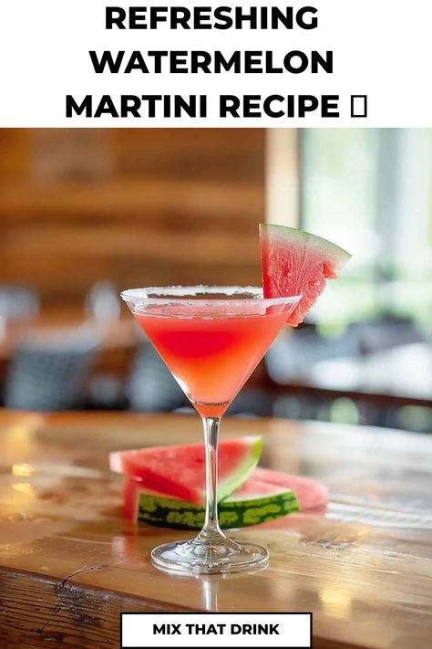 Refreshing watermelon martini with salt rim and watermelon slice garnish on a wooden bar top.