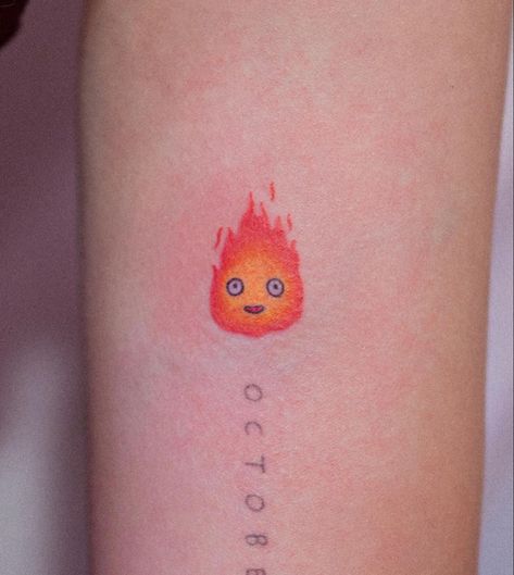 CALCIFER - HOWLS MOVING CASTLE (bongkee_ on instagram) Tiny Calcifer Tattoo, Small Calcifer Tattoo, Hals Moving Castle Tattoo, Ghibli Tattoo Minimalist, Calcifer Tattoo, Howl's Moving Castle Tattoo, Miyazaki Tattoo, Tatuaje Studio Ghibli, Ram Tattoo