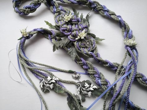 Create cherished memory of your special day with this sage green and lavender heirloom-worthy hand-fasting cord. Making for meaningful way of tying the knot, .this cord is made of double twisted cotton/viscose rope and adorned with decorative flowers and charms. Thistle Leaves, Lavender Wedding Colors, Witch Wedding, Wedding Knot, Wedding Cord, Wedding Coasters Favors, Wedding Ceremony Unity, Handfasting Cords, Pagan Wedding