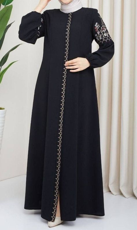 This beautiful Farasha style abaya has a plain inner maxi in fine jersey fabric with a chiffon embroidered loose outer layer and an embroidered matching belt for styling. Comes in standard size. Available in beige and black combination and black on black embroidery Stylish Borkha Design, Black Abaya Embroidery Design, Abaya Embroidery Design, Abaya Fashion Black, Zipper Abaya, Black On Black Embroidery, New Abaya Designs, Burqa Designs, Beautiful Abayas