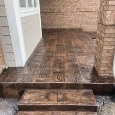 How Much Does a Stamped Concrete Patio Cost? Stamped Concrete That Looks Like Wood, Herringbone Stamped Concrete, Timber Stamped Concrete, Stamped Concrete With Brick Border, Stamped Concrete With Border, Wood Stamped Concrete, Stamped Concrete Patio Cost, Stamped Concrete Walkway, Stamped Concrete Patio Designs