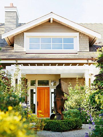 With a spacious and airy entry that opens to the second floor, this gabled dormer window lets light pour down the foyer. This once-dark space, now one of the home's brightest spots, serves as a warm and welcoming spot for visitors upon arrival. New England Craftsman Home, Craftmans Style House Exterior, Craftsman Curb Appeal, Craftsman Exteriors, Craftsman Houses, Bungalow Ideas, Small Bungalow, Craftsman Homes, Cozy Cottages