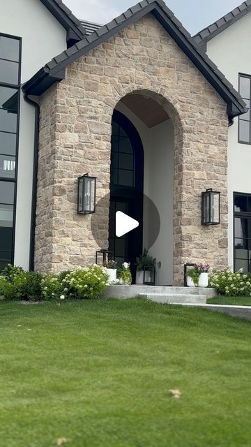 Kelly Griffiths on Instagram: "Save for later: make your home stand out from the rest by creating a grand entrance. We did a large stone arch at our front door. Not only does it protect the front from snow in the winter but it creates a great space for home decor and provides the grand entrance we were after. 

#home #grandentrance #arch #archlovers #homedesign #homedesignideas #homeinspo #designbuild #dreamhome #mountainhome #customhomes #modernhome #interiordesignideas #interiordesigners #homeinspiration #homeinspo #mydomaine #homegoals #familyhome #luxuryhomes #stone #englishhome #europeandesign #hydrangea" Front Arch Entrance, Arched Front Door Exterior, Arched Entryway Exterior, Grand Front Door, Arch Entryway, Arched Front Door, Houses Exterior, Lake Houses Exterior, Lake Houses