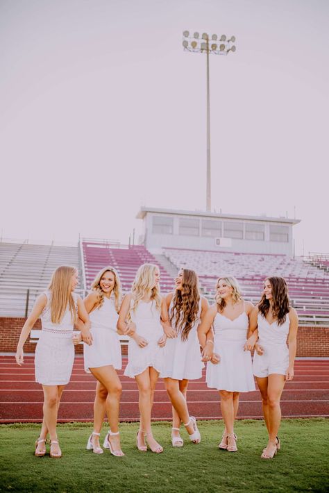 Senior cheer pictures  Group senior cheerleaders  Football field  Football stadium  White dress Group Senior Pictures, Dance Team Pictures, Drill Team Pictures, Senior Cheerleader, Cheer Team Pictures, Field Football, Cheer Photography, Cap And Gown Pictures, Cheers Photo