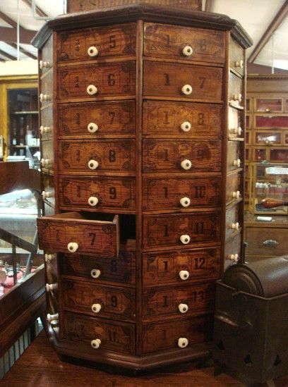 I am drooling over this stunning octagon-shaped wooden cabinet, with 72 pie-shaped drawers. Hardware cabinet. Manufactured by The American Bolt and Screw Case Company. Dayton, OH. (1880-1909). Always see it at my grandmother's place...want one for myself! Round Top Texas Antiques, Round Top Antiques, House Remodeling, Vintage Hardware, Drawer Hardware, Antique Hardware, Wooden Cabinets, Remodeling Ideas, Hardware Store