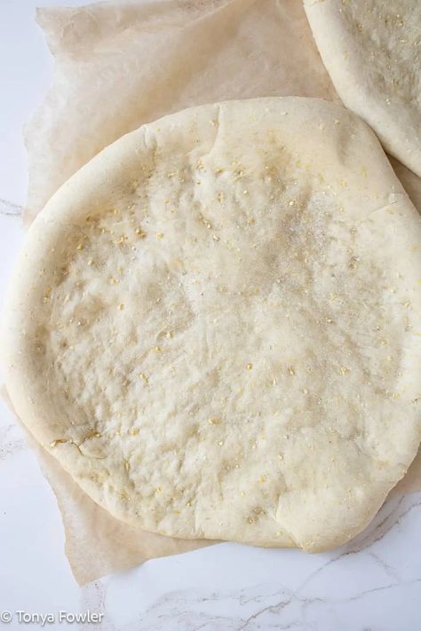 Cornmeal pizza crust on a parchment paper. Cornmeal Pizza Crust, Quick Pizza Crust, Cornmeal Crust, Midwest Kitchen, Cornmeal Recipes, School Pizza, Mix Pizza, Homemade Pizza Crust, Skillet Pizza