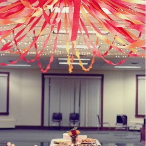 DIY party decorations are so inexpensive and simple, and these Fun and Festive Ceiling Streamers are no exception. Party Streamer Ideas Ceilings, Streamer Ceiling, Baby Shower Food Easy, Ceiling Streamers, Midsummer Party, Baby Shower Cake Table, Food Tables, Ideas For Baby Shower, Rainbow Parties