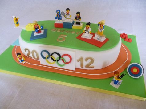 Olympics Cake - This cake, decorated with Team GB Lego Minifigures, was a real talking point at Barney's olympic themed birthday party Running Cake, Office Olympics, Olympic Theme Party, Emoji Cupcakes, Olympics Party, 73rd Birthday, 75th Birthday Parties, Olympic Theme, Olympic Party