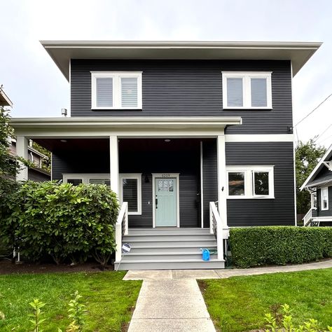 Sharing a gorgeous exterior paint transformation! Absolutely love that this client wasn't afraid to go dark - it is so elegant. The little pop of color on the front door is the perfect cheery moment to offset a more dramatic color on the siding. We still have paint color consultation appointments in July! Head to our website to get on the schedule with our amazing color consultant. . Siding: Jet Black 2120-10 Trim: Grandma’s China CSP-365 Front Door: Sylvan Mist CSP-740 Porch + Steps: Grayst... Paint Transformation, Craftsman Remodel, Color Consultant, Color Consultation, Custom Bench Cushion, Siding Colors, Exterior Paint Color, Colour Consultant, Porch Steps