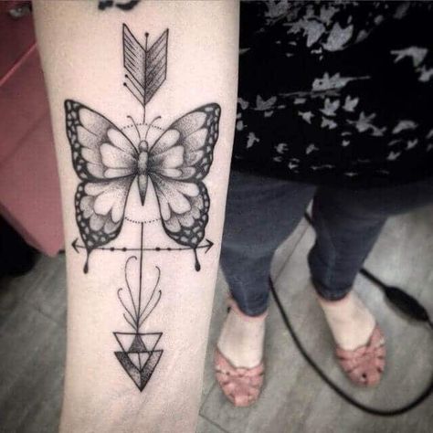 If you are looking for butterfly tattoos that have something special about them, this design is perfect. The black/grey/white design is very symmetrical and even has an arrow going through it for a style that stands out from the crowd. #tattoofriday #tattoos #tattooart #tattoodesign #tattooidea Arrow Tattoo Arm, Meaning Of Arrow Tattoo, Tattoo Son, Purple Tattoos, Butterfly Back Tattoo, Arrow Tattoo Design, Girl Arm Tattoos, Butterfly Tattoos For Women, Butterfly Tattoos