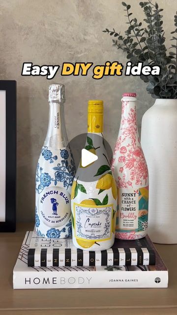 Michelle McRae | “Shelly” Your DIY BFF on Instagram: "Details 👇🏽  If you have ever searched the internet for heartfelt or handmade gifts, these decoupaged bottles are so special. Whether it is for a hostess, bridesmaid, teacher or girlfriend, these decoupaged bottles are both beautiful and one-of-a-kind. Not only that, they’re both easy and affordable also!  Buy a few bottles of bubbly, paint them with any white paint you have laying around your house, glue on the designs or patterns from one pretty napkin and, for a little extra shine, spray on a little paint sealer. Better yet, invite over some girlfriends, and host a DIY night!  Let’s just say, if you invite me over, you know what I’ll be bringing!🍾  Comment “BOTTLE” for links 🔗 (earns commissions)‼️  #easydiys #diygift" Decoupage Wine Bottles With Napkins, Decopage Ideas Wine Bottles, How To Decoupage With Napkins, Decoupage Bottles Ideas, Decoupage Wine Bottles, Decopatch Ideas, Painting Bottles, Diy Bff, Decoupage Bottles