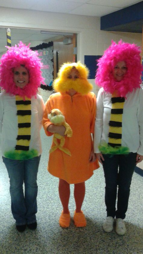 Lorax and truffula trees for Dr. Seuss' birthday celebration! Reading week Lorax And Tree Costume, Lorax Tree Costume, The Lorax Costume Group, Lorax Character Costumes, Lorax Halloween Costumes Family, Dr Suess Dress Up Ideas For Teachers, The Lorax Trio Costume, Lorax Halloween Costumes Group, Truffala Tree Costume