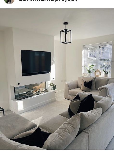 Grey U Shape Sofa, Cream And Black Lounge, Lounge With Media Wall, Council House Living Room Ideas, Media Wall Small Living Room, Living Room Designs Uk, Tv Wall Ideas Living Room Small Spaces, Uk Living Room Ideas, Best Living Room Ideas