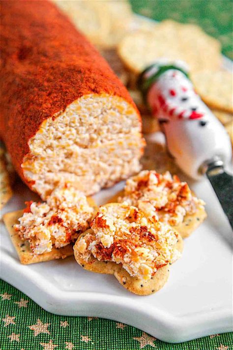 Cheese Roll - the BEST cheese ball recipe EVER! Super easy to make and even easier to eat. Cheddar cheese, cream cheese, dry mustard, hot sauce, garlic, mayonnaise, and Worcestershire - mix together and roll in a mixture of chili powder and paprika. Great for parties! I am totally addicted to this cheese roll! I could literally eat the whole thing! Serve with crackers or veggie slices. #appetizer #glutenfree #lowcarb #partyfood #gameday #cheese The Best Cheese Ball, Best Cheese Ball, Cheese Log Recipes, Cheese Roll Recipe, Garlic Mayonnaise, Cheddar Cheese Ball, Cheese Log, Cheese Roll, Xmas 2022