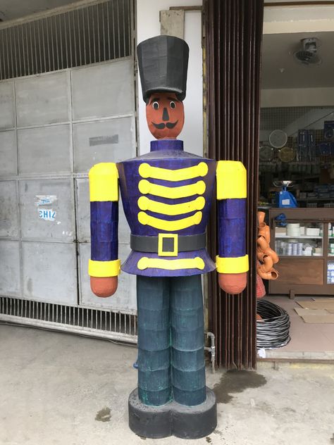 A nutcracker soldier made out of cardboard boxes and old sheets of newspaper #DIY #RecycledChristmasDecor #KalingaDIYer #DIYCraft Newspaper Diy, Colorful Christmas Decor, Electrical Shop, Old Sheets, Nutcracker Soldier, Colorful Christmas, Garbage Truck, Some Ideas, My Mother