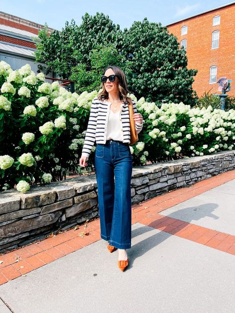 Step into the boardroom with confidence! Explore my post for 10 summer business casual outfit ideas that strike the perfect balance between professionalism and style. I know wide leg jeans are trending right now but they will always be a great choice for a business casual environment where you can wear jeans. Blue And White Striped Cardigan Outfit, Ways To Style A Cardigan, Striped Cardigan Outfit, Style A Cardigan, How To Style A Cardigan, Cardigan With Jeans, Summer Business Casual Outfits, Business Casual Dress Code, Red Wrap Dress