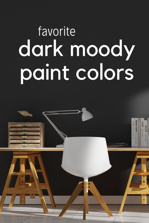 A wood desk with a white chair in front of a dark black moody painted wall Dark Moody Paint Colors Benjamin Moore, Sherwin Williams Moody Colors, Moody Wall Color, Dark Moody Paint Colors, Modern White Farmhouse, Moody Paint Colors, Moody Paint, Dark Paint Colors, Favorite Paint Colors