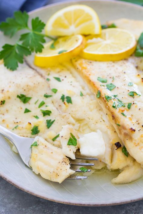 Easy Baked Tilapia with Lemon Garlic Butter! A quick weeknight meal that the whole family will love. The tilapia is drizzled with a lemon garlic butter sauce and then baked to flaky perfection – one of the easiest tilapia fish recipes! Easy Tilapia, Tilapia Recipes Easy, Baked Tilapia Recipes, Lemon Garlic Butter Sauce, Tilapia Fish Recipes, Tilapia Recipe, Tilapia Fish, Baked Tilapia, Tilapia Recipes