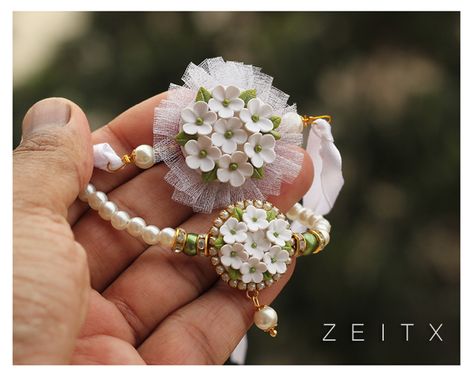 polymer clay floral rakhi by zeitx Polymer Clay Rakhi, Clay Rakhi, Clay Embroidery, Handmade Rakhi Designs, Rakhi Making, Diy Necklace Making, Polymer Clay Embroidery, Handmade Rakhi, Rakhi Design