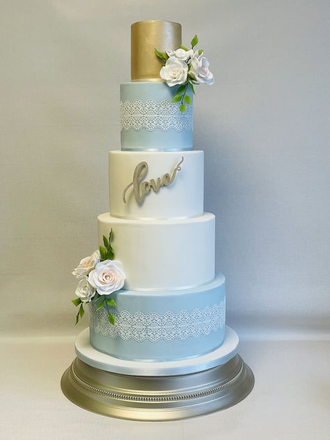 Vendela, striking 5 tier wedding cake with powder blue tiers decorated with edible lace and sprays of sugar vendela roses with foliage 5 Tier Wedding Cake, Vendela Roses, 5 Tier Wedding Cakes, Powder Blue Wedding, Blue Wedding Cake, Edible Lace, Lace Wedding Cake, Wedding Cakes Blue, Wedding Cake Designs