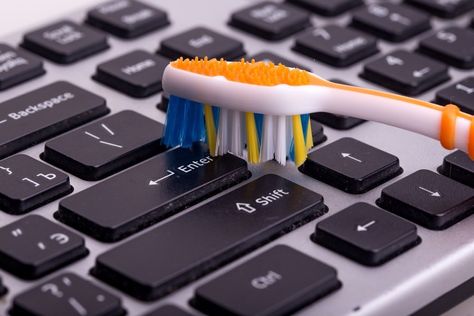 Though adding your keyboard to your list of things to clean might be the last thing you want to do, the good news is that it’s relatively easy to cross this task off your to-do list. All you have to do is dip a toothbrush in a half vinegar/half water solution and scrub-a-dub-dub both on and between those keyboard keys to eliminate any germs. Remove Ink From Fabric, Build A Shoe Rack, Cleaning Shoes, Easy Cleaning Hacks, Tooth Brush, Family Handyman, Dental Floss, Hydrogen Peroxide, Coffee Staining