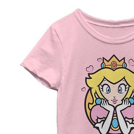 Your mini gamer fan will love this little and big girls' graphic t-shirt featuring Princess Peach from Super Mario. Crafted from 100% cotton in a regular-fit, this short-sleeve crew-neck tee features a Princess Peach graphic on the front and will pair perfectly with her favorite skirts or jeans. Character: Super MarioClosure Type: Pullover HeadFit: Regular FitNeckline: Crew NeckSleeve Length: Short SleeveApparel Length: 20 InchesFiber Content: 100% CottonFabric Description: KnitCare: Machine Was Peach Graphic, Tops Graphic, Large Shirts, Mini Games, Crew Neck Tee, Super Mario, Princess Peach, Shirts Tops, Graphic T Shirt