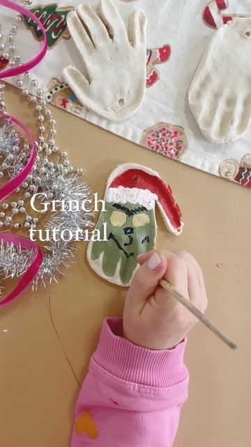 Kelly Oester | Content Creator on Instagram: "This is our third year making these and these little hands seemed to have grown 'three sizes this day' 😈✨🎄 ✨Grinch Salt Dough Handprint Ornament✨ #diy #makeitwithmichaels #hgtvhandmade #diychristmas #saltdoughornaments #diyornaments" Clay Handprint Ornaments Diy, Salt Dough Ornaments Grinch, Turkey Salt Dough Crafts, Christmas Handprint Ornaments Diy Kids, Salt Dough Reindeer Footprint, Grinch Hand Ornament, Elf Handprint Ornament, Grinch Salt Dough Ornament, Diy Clay Ornaments For Kids