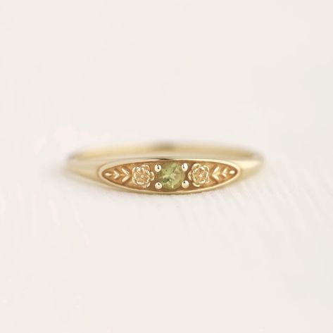 August birth ring This ring will be a very meaningful piece for those born in August . August's birthstone and birth flower are Peridot and Poppy. Greeny peridot and delicately carved poppy will shine and bloom forever. This dainty and slim signet ring is comfortable to wear all the time. This piece will be perfect gift for both to others and yourself. * Detail * Material : 14K solid gold, 18K solid gold, 925 sterling silver Color : Yellow gold, White gold or Rose gold(925 sterling silver is exc Cheap Dainty Round Birthstone Ring, Affordable Dainty Engraved Ring For Gift, Cheap Gold Birthstone Ring, Vintage Gemstone Ring Small, Cheap Dainty Birthstone Ring, Dainty Sunburst Ring, Cheap Elegant Engraved Ring For Women, Boho Rose Gold Rings, Affordable Engraved Rings