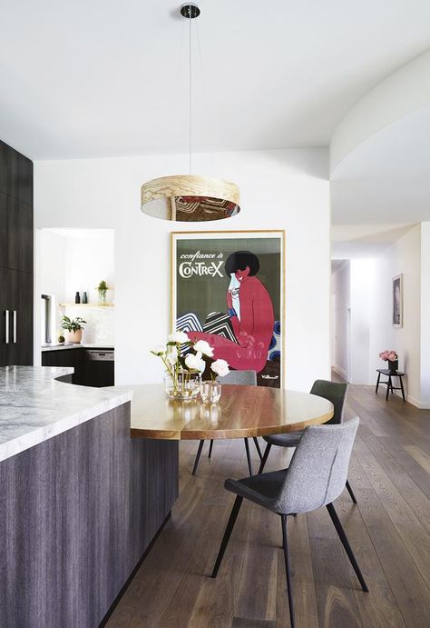 In this renovated [century-old Edwardian home] the kitchen island features a built-in circular dining table that acts as additional bench space, as well as seamlessly integrates the dining zone. The contrast of materials from the marble benchtop to the timber tabletop adds a rich mix of textures to the space. *Styling: Heather Nette King | Photography: Armelle Habib*. Edwardian Home, Kitchen Built In, Kitchen Island Dining Table, Kitchen Island Bench, Circular Dining Table, Australian Style, King Photography, Island Bench, Classic Kitchen