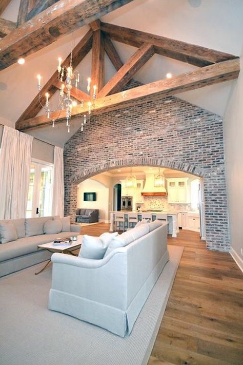 Vaulted Living Room Open Concept, Brick Between Kitchen And Living Room, Open Brick Wall Living Room, Indoor Brick Wall Ideas Living Room, Brick In Living Room, Exposed Brick Walls Living Room, Living Room With Exposed Brick, Exposed Brick Living Room, Interior Beams