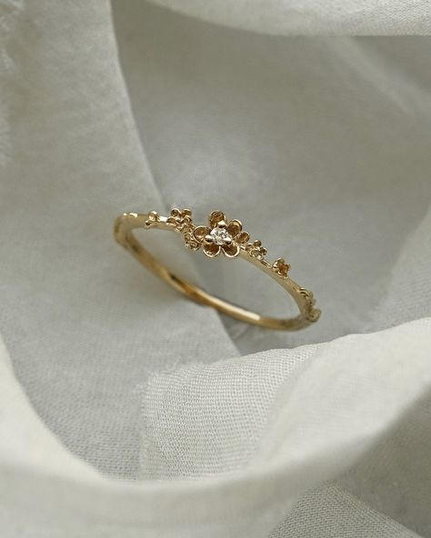 Petite petals of gold to float across your finger🌼 Our Buttercup Ring with a drop of diamond dew glittering at her centre — today is your last chance to get this special customization and more for 15% off on our website! Our Secret Menu Sale ends tonight at 11:59pm EST🧚 Rings Gold Aesthetic, Buttercup Ring, Stylish Jewelry Accessories, Magical Wolf, Hand Jewelry Rings, Gold Finger Rings, Elegant Gloves, Fairy Ring, Cute Engagement Rings