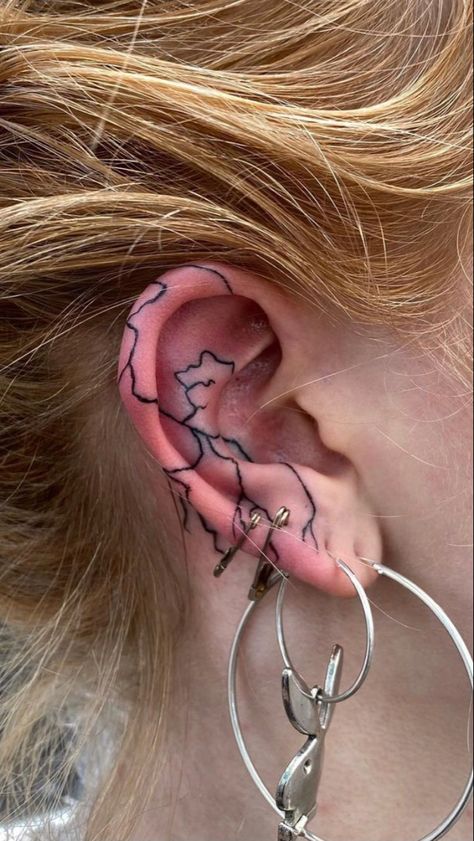 Ear Tattoo Inspiration, Ear Tattoo Lightning, Flame Ear Tattoo, Inner Ear Tattoo, Blitz Tattoo, Emo Tattoos, Pretty Hand Tattoos, Shape Tattoo, Clever Tattoos