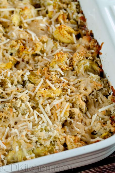 Artichoke Casserole - It doesn't get much easier than this. Chopped artichoke hearts mixed with breadcrumbs and parmesan and baked until nice and crispy. Awesome for changing up your normal side dish rotation. Made with artichoke hearts, bread crumbs, olive oil, Parmesan cheese, salt & cayenne pepper | CDKitchen.com Artichoke Casserole Recipes, Artichoke Recipes Baked, Artichoke Casserole, Artichoke Heart Recipes, Vegetable Casseroles, Baked Artichoke, Thanksgiving Recipe, Thanksgiving 2020, Artichoke Recipes