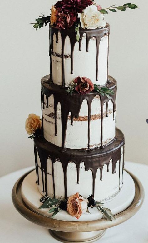 a fantastic three tier naked wedding cake with chocolate drip, blooms, greenery is a gorgeous idea for many weddings Vintage Pasta, Green Wedding Cake, Cake With Flowers, Pretty Wedding Cakes, Fondant Wedding Cakes, Black Wedding Cakes, Wedding Cake Ideas, Wedding Cake Recipe, Wedding Cake Flavors