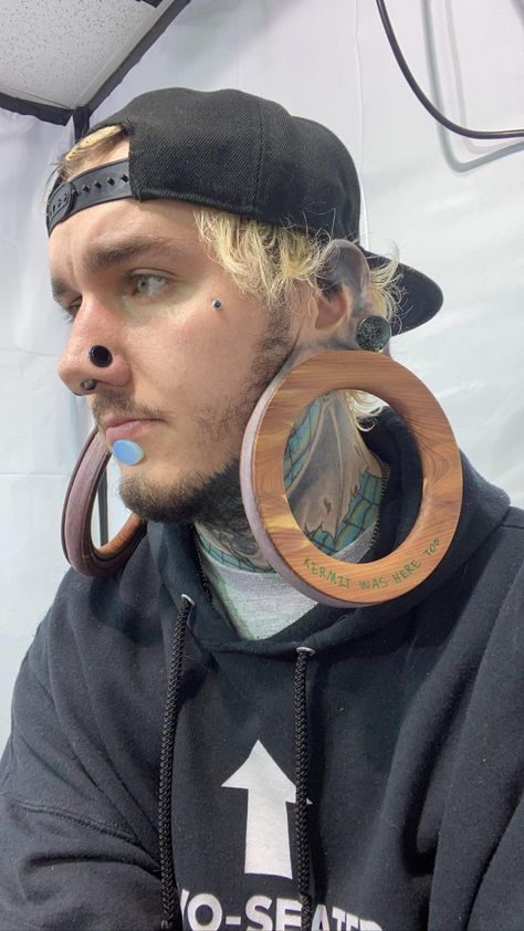 Tattoos For Guys Minimalist, Male Ear Piercing Men, Guy With Ear Piercing, Guys With Face Piercings, Stretched Ears Men, Guy Ear Piercings, Tattoo Placement Men, Simple Ear Tattoos, Men Ear Tattoo