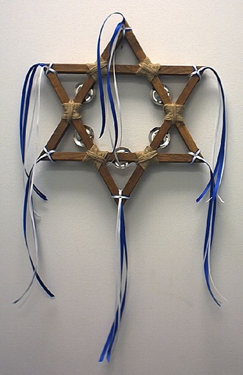 Star of David Wooden Tambourine    $29.95      Our tambourines are handmade from pine wood and finished in a Country Walnut Stain. The joints are wrapped in jute with five sets of jingles and trimmed with blue and white satin ribbons. Rainbow Products, Worship Flags, Dance Garments, Chanukah Decor, Satin Ribbons, Tambourine, Walnut Stain, Pallet Wood, Star Of David