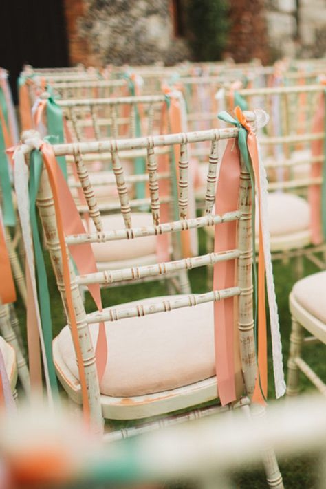 Pink, orange, green, and white ribbons tied onto the wedding chairs for the ceremony Ribbon Chair Decor, Chair Ribbons Wedding, Wedding Chairs Decorations, Chairs For Wedding, Lilac Theme, Wedding Car Ribbon, Wedding Chair Decor, Gold Chivari Chairs, Wedding Streamers