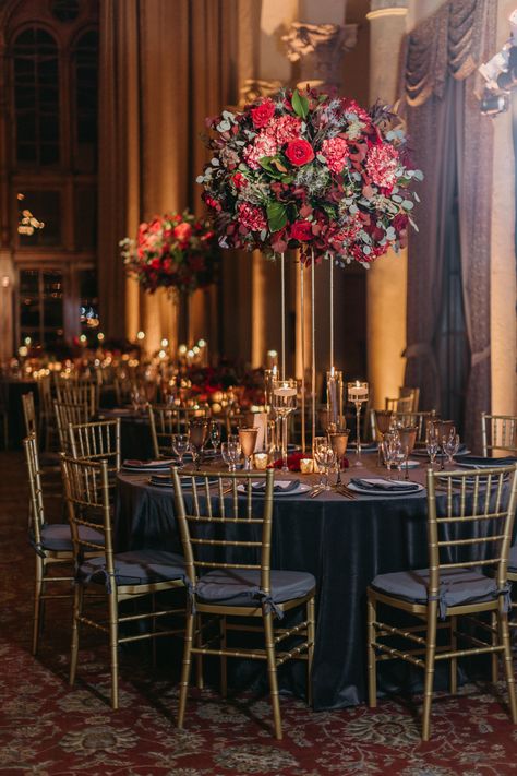 Deep Red Wedding Centerpieces, Dark Wedding Reception Aesthetic, Vintage Moody Wedding, Dark Color Wedding Themes, Jewel Tone Reception Decor, Jewel Tone Wedding Centerpieces Round Table, Deep Red Wedding Reception, Tall Moody Wedding Centerpieces, Moody Wedding Table Setting