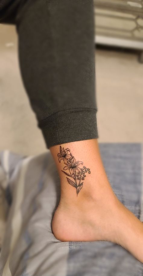 Lily Leg Tattoos Women, Lily Wrap Around Wrist Tattoo, Lily Tattoo Ankle, Lily Ankle Tattoo, Lily Ankle Tattoo For Women, Lilys With Butterfly Tattoo, Lily Of The Valley Tattoo, Ankle Tat, Valley Tattoo