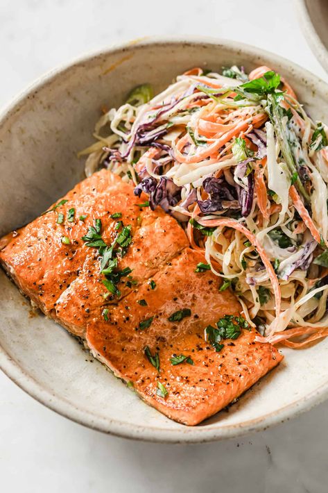 This salmon and cabbage slaw is perfect for dinner or lunch and is fuss-free, healthy and ready in 20 minutes flat. Salmon Slaw Bowl, Salmon With Cabbage, Salmon And Slaw, Salmon With Cabbage Slaw, Salmon Coleslaw Bowl, Cabbage And Salmon Recipes, Salmon And Coleslaw, Salmon Cabbage Recipes, Salmon And Cabbage