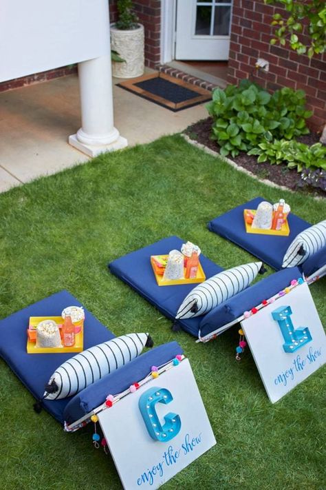 We've put together a list of everything you need for an amazing backyard movie night, from the best outdoor projector to the ultimate movie snacks. Once you have everything you need for your outdoor movie night, you'll be all set to make it a regular summer tradition.  #outdoor, #backyard, #movie, #movies, #DIY, #How-To, #summer, #yard, #family-night, #games, #culture, #decor, #shopping-guide Movie Night Seating, Diy Backyard Movie, Backyard Movie Night Party, Diy Backyard Movie Night, Movie Seats, Diy Movie Night, Outdoor Movie Party, Outside Movie, Backyard Movie Party