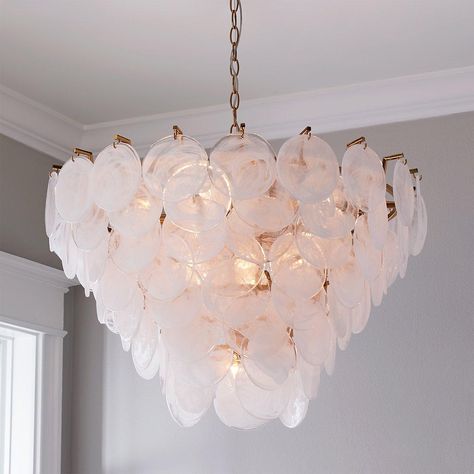 We are blown away by the design of our Bali Shell Chandelier.  This elegant silhouette is crafted from layers of translucent swirled glass shells, showcasing a natural soft aesthetic.  A rose-pink tint of diffused light will shine through to your upscale dining room or your classic beachy bedroom. Transitional Bedroom Chandelier, Bathroom Chandelier Over Tub, Capiz Shell Chandelier, Bathroom Chandelier, Coastal Chandelier, Beachy Bedroom, Coastal Lighting, Shell Chandelier, French Modern