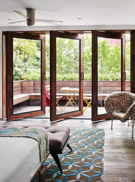 In Tia Cibani's master suite, the architect created a sizable terrace. The wood floors within the room run right out of doors, establishing a subtle sense of continuity. Thus, says Dubbeldam, “the balcony becomes part of the bedroom.” The coin chair is by Johnny Swing. The bed is from Design Within Reach. Terrasse Design, Balcony Doors, Bedroom Balcony, Attic Renovation, Sliding Glass Doors, Chelsea House, Terrace Design, The Loft, Balcony Design