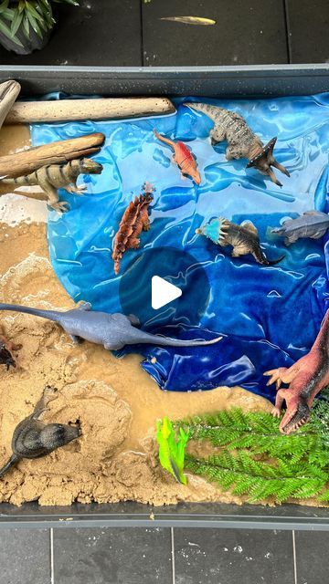 Sam • Easy Messy and Sensory Play Ideas on Instagram: "This was so easy to make!

And my girls spent forever playing with it 🤩

Hit that Save button so you can recreate this yourself 😉

All you need to make this is:
- Play sand for the beach 
- @funsquare_aus scarf from the beautiful @clever_bugs 
- Water
- Dinosaurs

I added a few Jurassic looking branches and some sticks for decoration 😍

My girls loved stomping the dinosaurs around the sand and the water, making their own little story lines 🦖 

Would you love to recreate this? What’s your little ones favourite small world?

Thank you @our.tiny.moments for the awe inspiration ❤️

• @clever_bugs - DC messy10
• @featherandleafco (Sticks) - DC messy15
• @rudienudie_designs (messy mat) DC in bio

#smallworld #smallworldplay #messyplay #s Water Dinosaurs, Sensory Play Ideas, Story Lines, Play Sand, Preschool Arts And Crafts, Messy Play, Small World Play, Play Ideas, Preschool Art